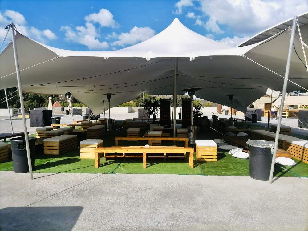 White Stretch Tent With Wooden Furniture
